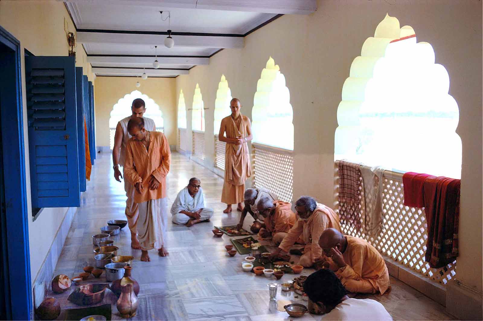 Śrīla Śrīdhara Mahārāja taking prasādam with Śrīla Prabhupāda